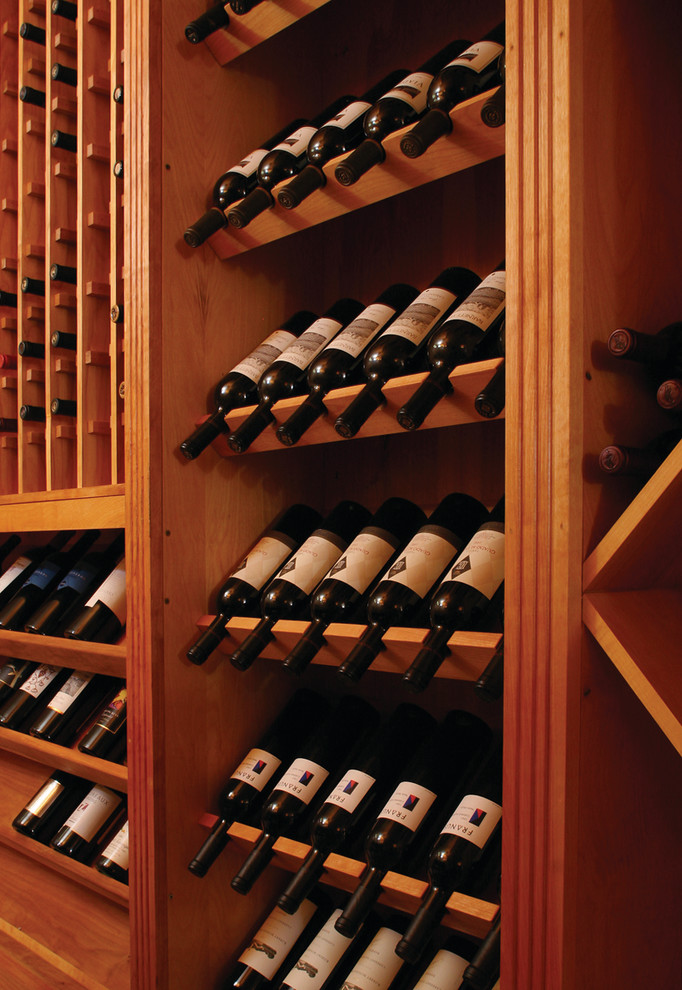 Wine cellar - large traditional wine cellar idea in New York with display racks