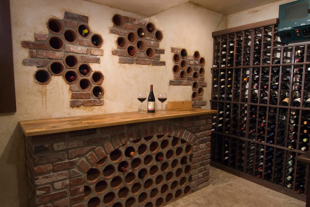 Wine cellar - mid-sized mediterranean ceramic tile wine cellar idea in Philadelphia with storage racks