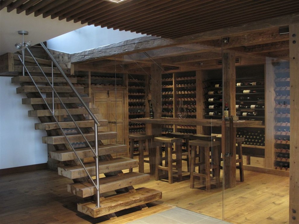 Example of a mountain style wine cellar design in Montreal