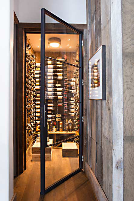 Example of a mountain style wine cellar design in Birmingham
