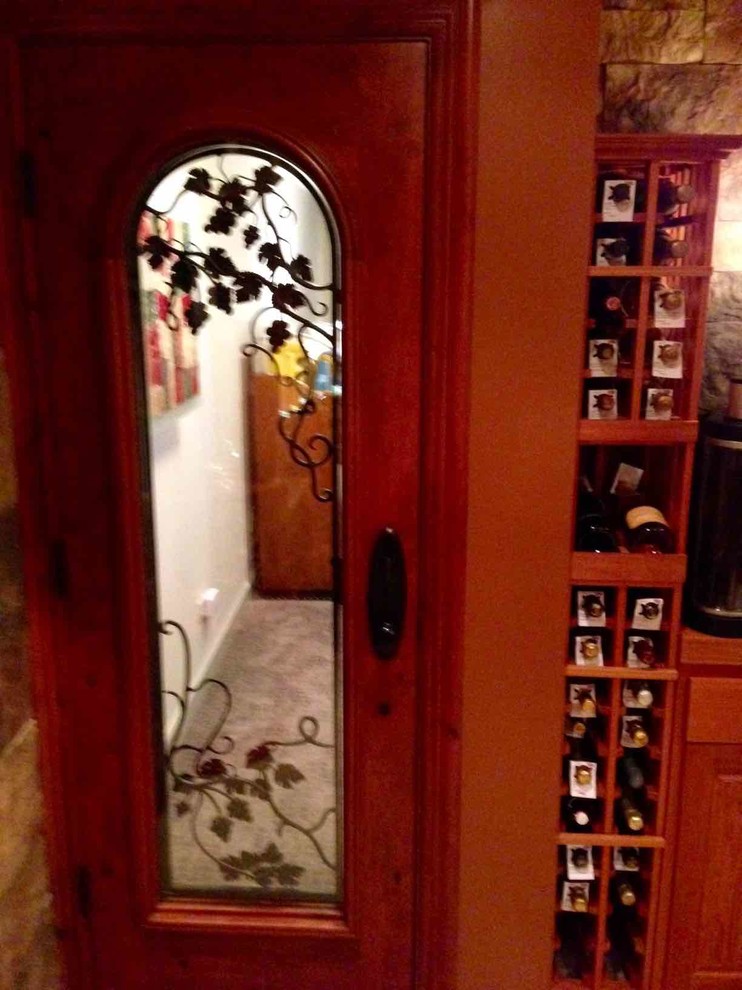 Mid-sized elegant wine cellar photo in Dallas with storage racks