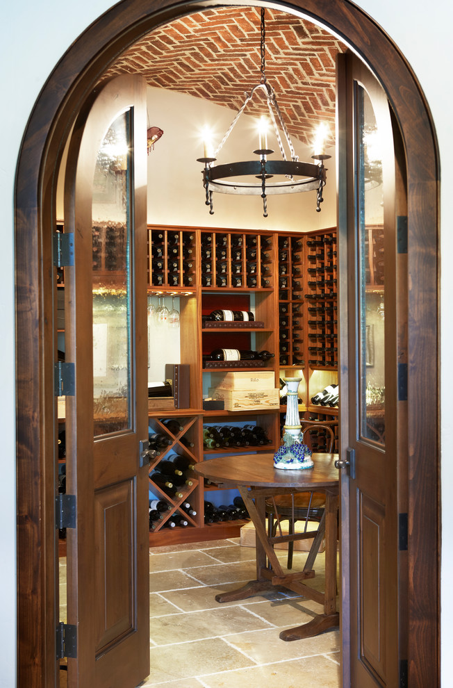 Large mountain style wine cellar photo in Other