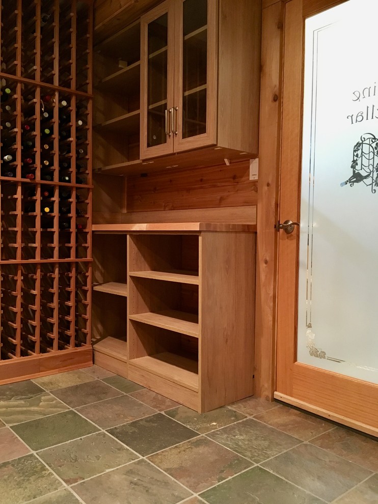 Design ideas for a medium sized classic wine cellar in Chicago with ceramic flooring, display racks and green floors.