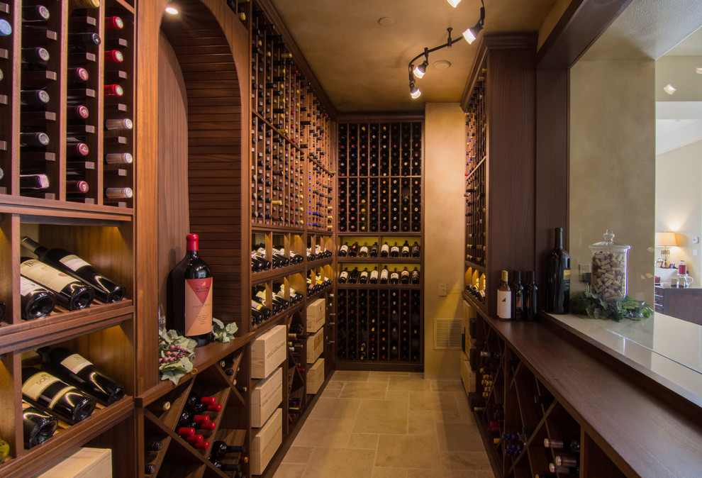 Inspiration for a medium sized traditional wine cellar in Los Angeles with storage racks and beige floors.