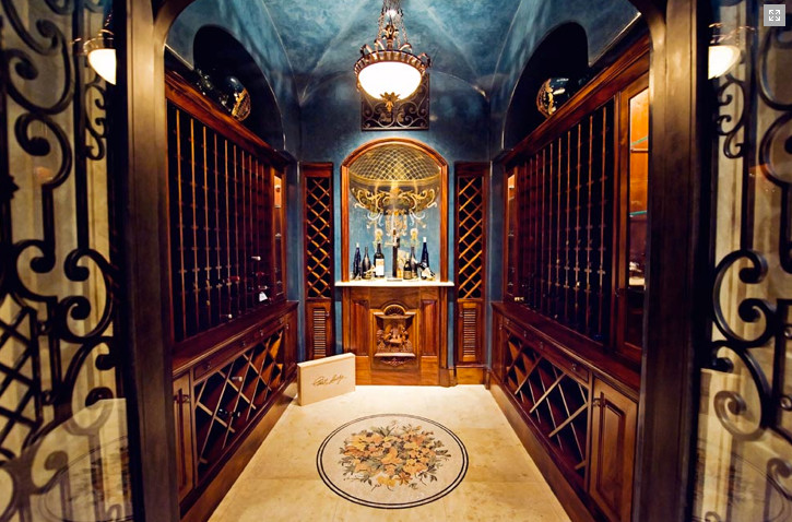 Photo of a large wine cellar in Dallas with storage racks and travertine flooring.