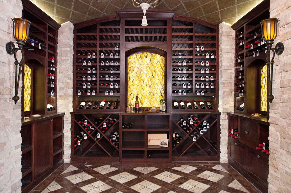 This is an example of an expansive traditional wine cellar in Kansas City with porcelain flooring, display racks and beige floors.