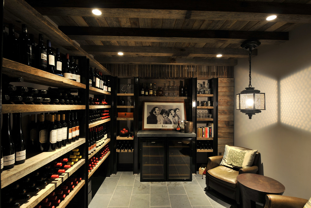 Example of a tuscan wine cellar design in Sydney with display racks
