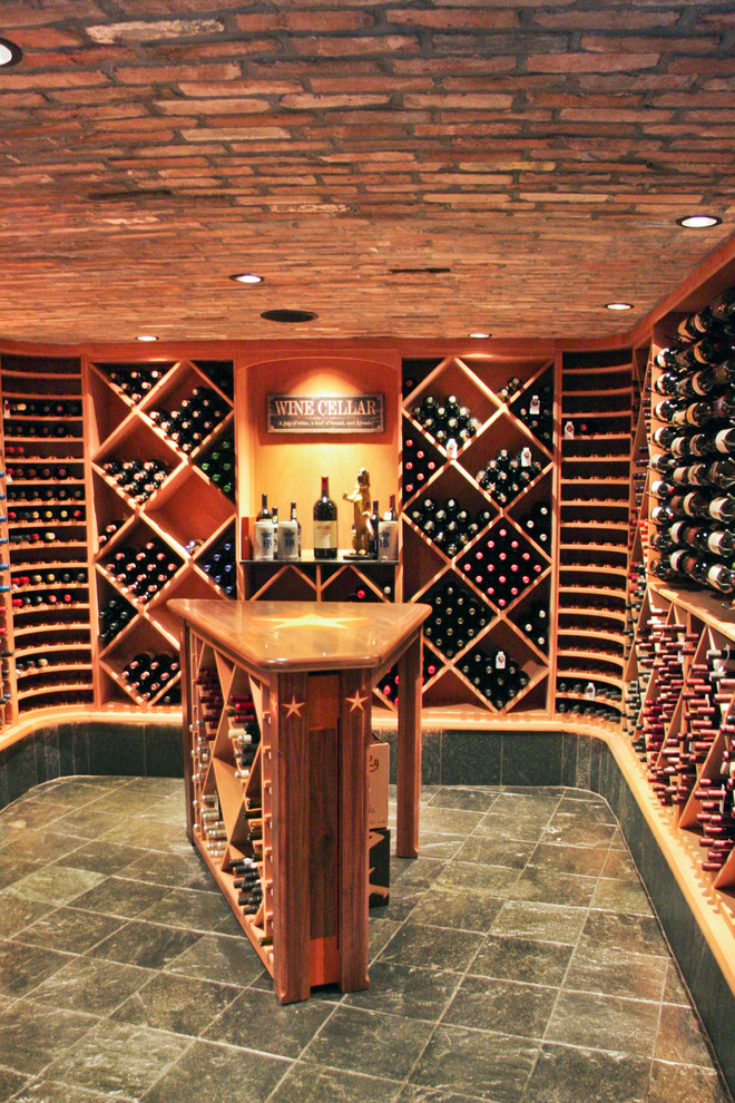 Wine cellar - rustic wine cellar idea in Houston with diamond bins