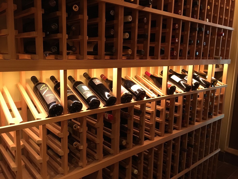 Inspiration for a mid-sized timeless wine cellar remodel in San Diego with storage racks