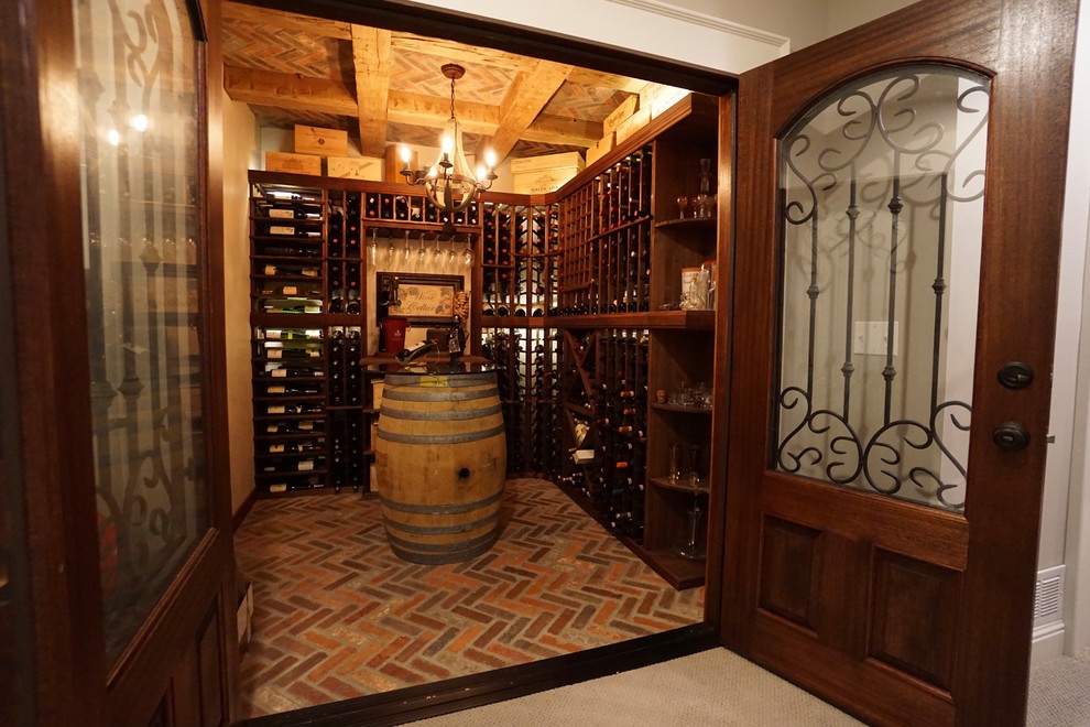 Inspiration for a small mediterranean brick floor wine cellar remodel in Columbus with storage racks
