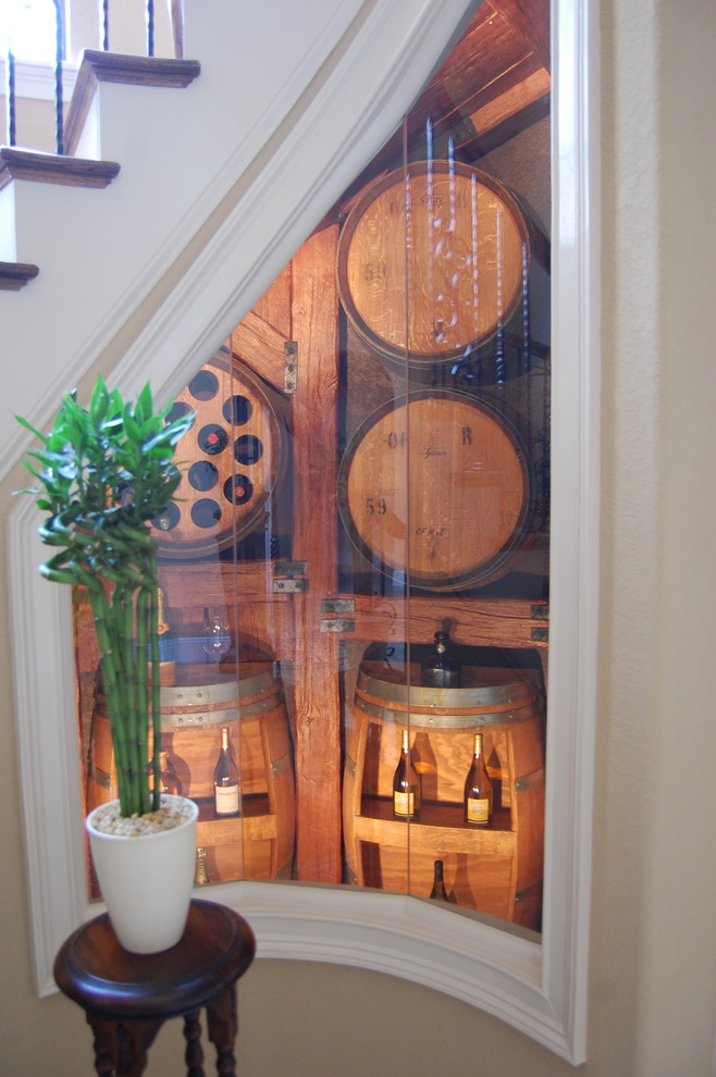 Design ideas for a small traditional wine cellar in Charlotte with display racks.