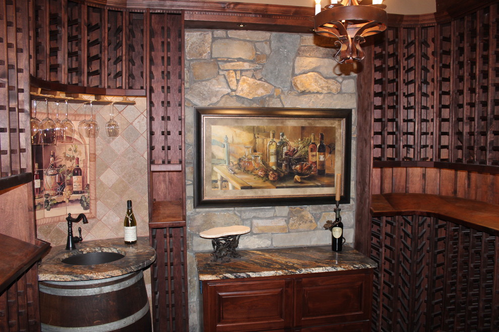 Wine cellar - mid-sized craftsman wine cellar idea in Phoenix with storage racks