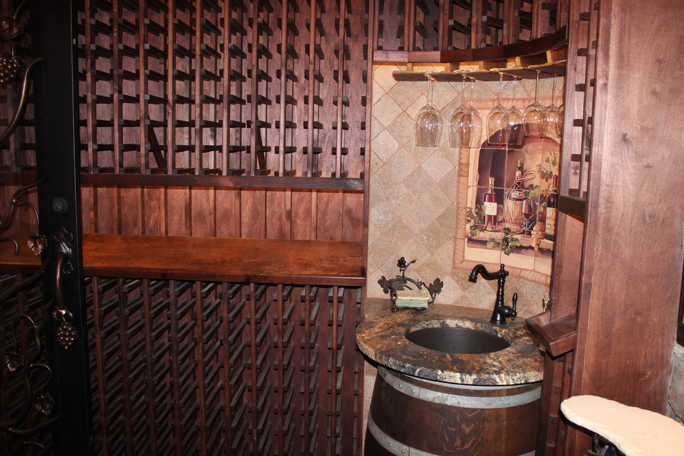 Medium sized classic wine cellar in Phoenix with storage racks.