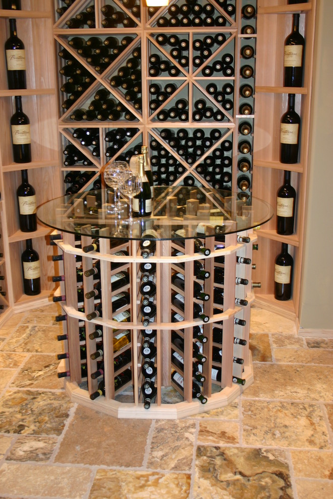 Inspiration for a mid-sized transitional travertine floor and beige floor wine cellar remodel in Philadelphia with storage racks