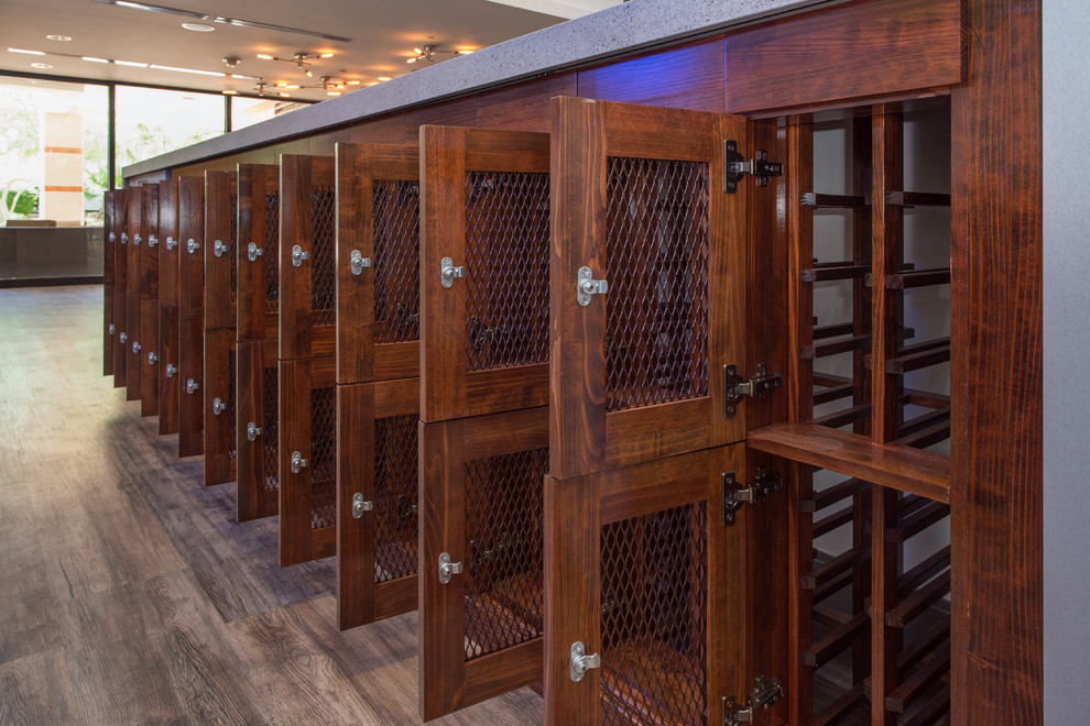 Design ideas for a small modern wine cellar in Phoenix with storage racks.