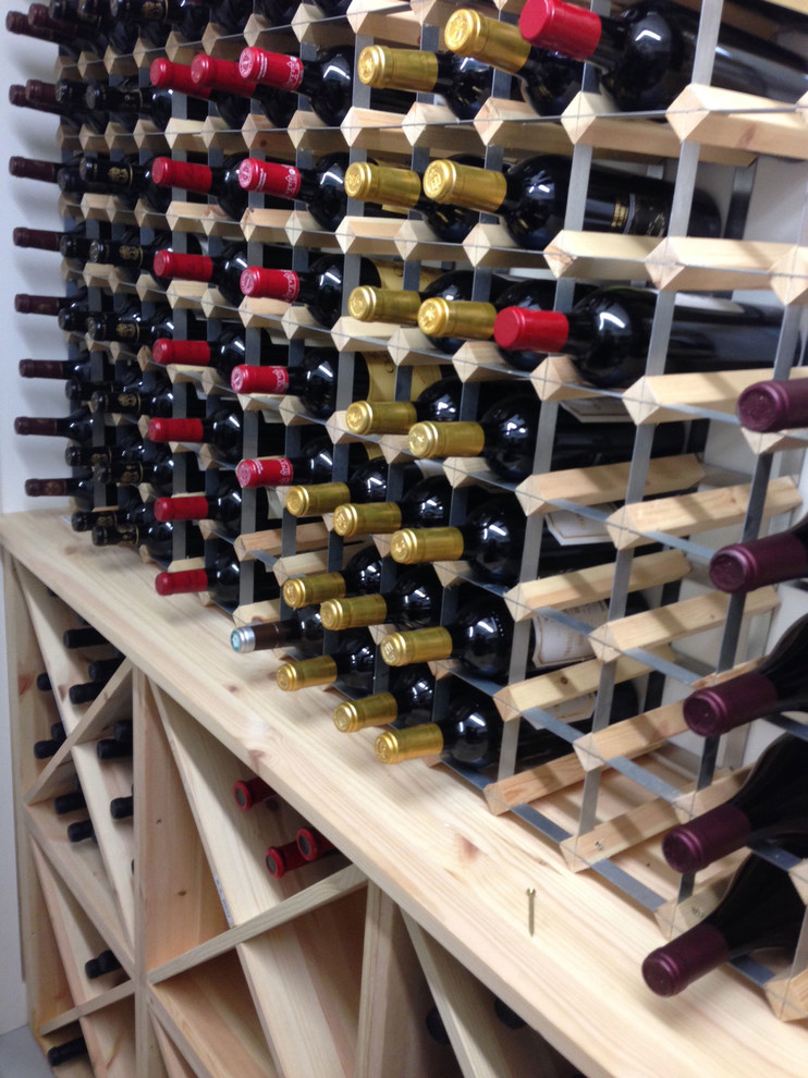 Inspiration for a small wine cellar in Sussex with storage racks.
