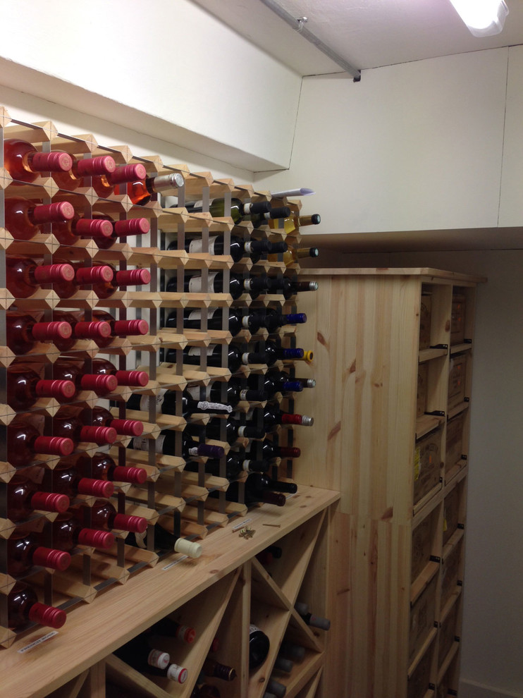 Small wine cellar in Sussex with storage racks.