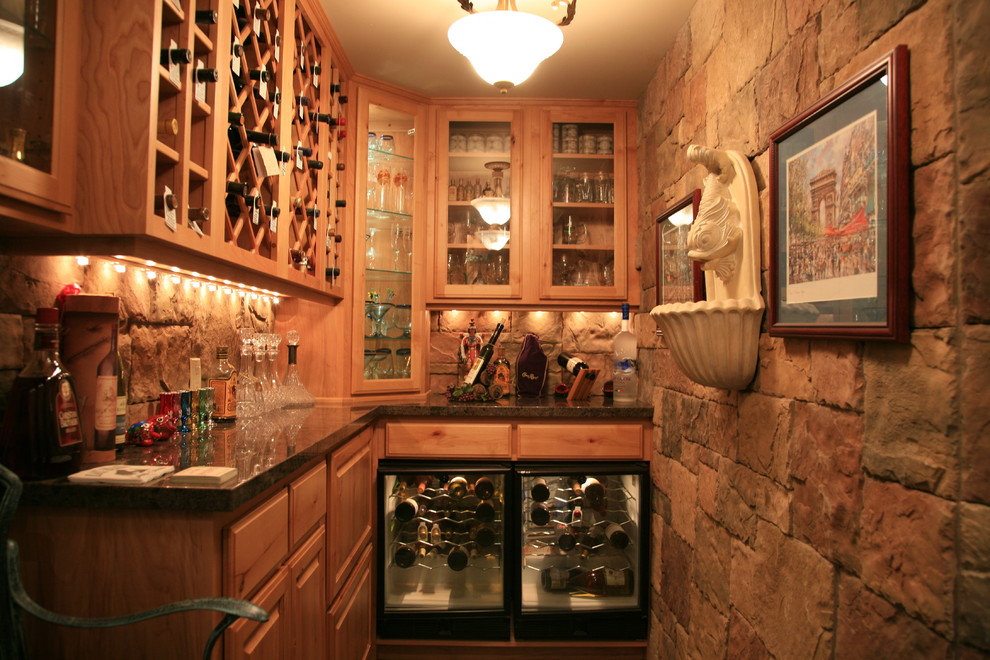 Mid-sized elegant wine cellar photo in Phoenix with display racks