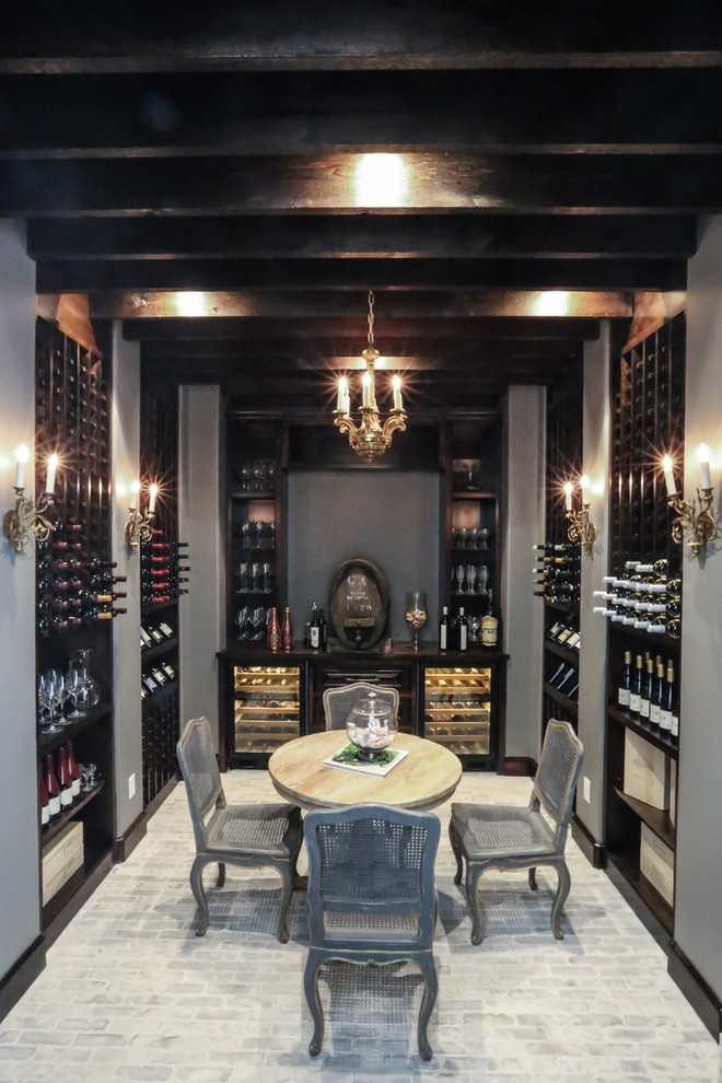 Design ideas for a large traditional wine cellar in Houston with brick flooring and display racks.