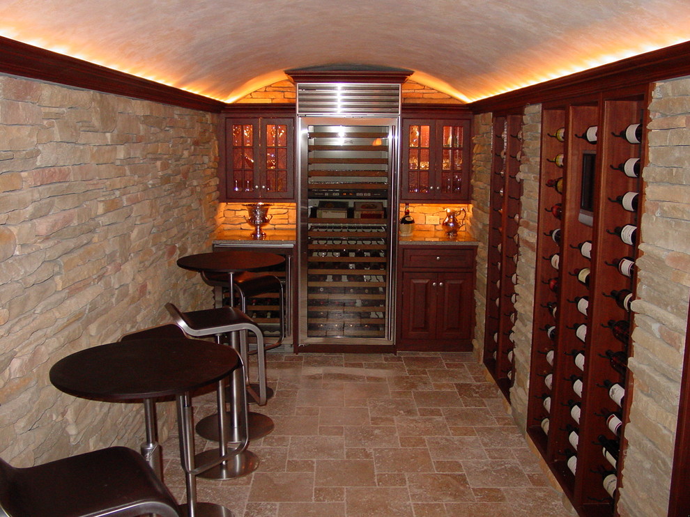 Wine cellar - mid-sized transitional wine cellar idea in New York with display racks