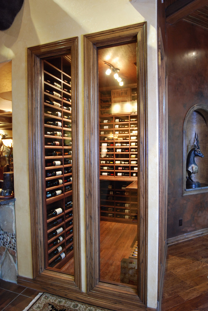 Example of a tuscan wine cellar design in Austin