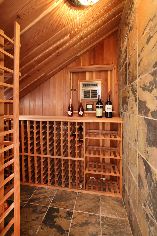 Photo of a classic wine cellar in Orange County with storage racks.