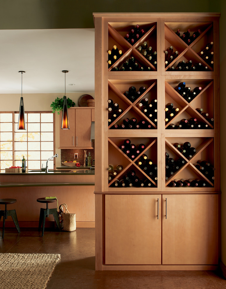 Foto på en mellanstor funkis vinkällare, med betonggolv, vinställ med diagonal vinförvaring och beiget golv