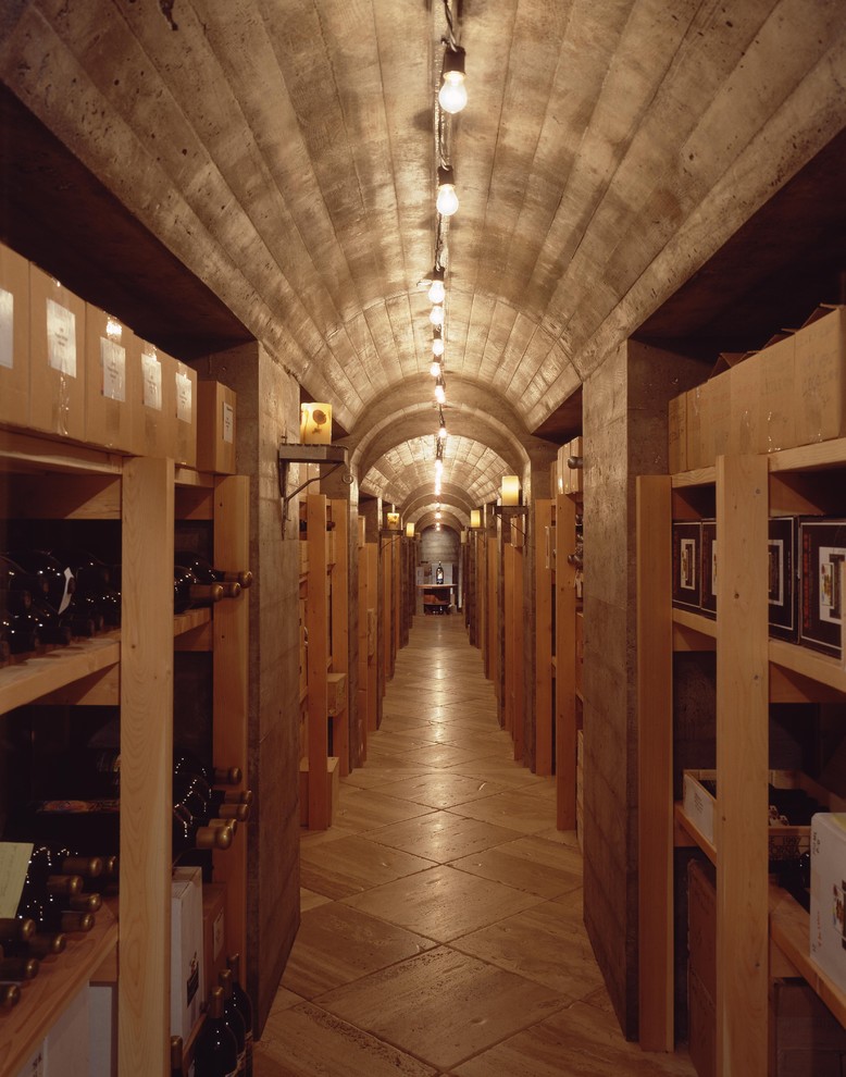 Design ideas for an expansive industrial wine cellar in Seattle with concrete flooring.