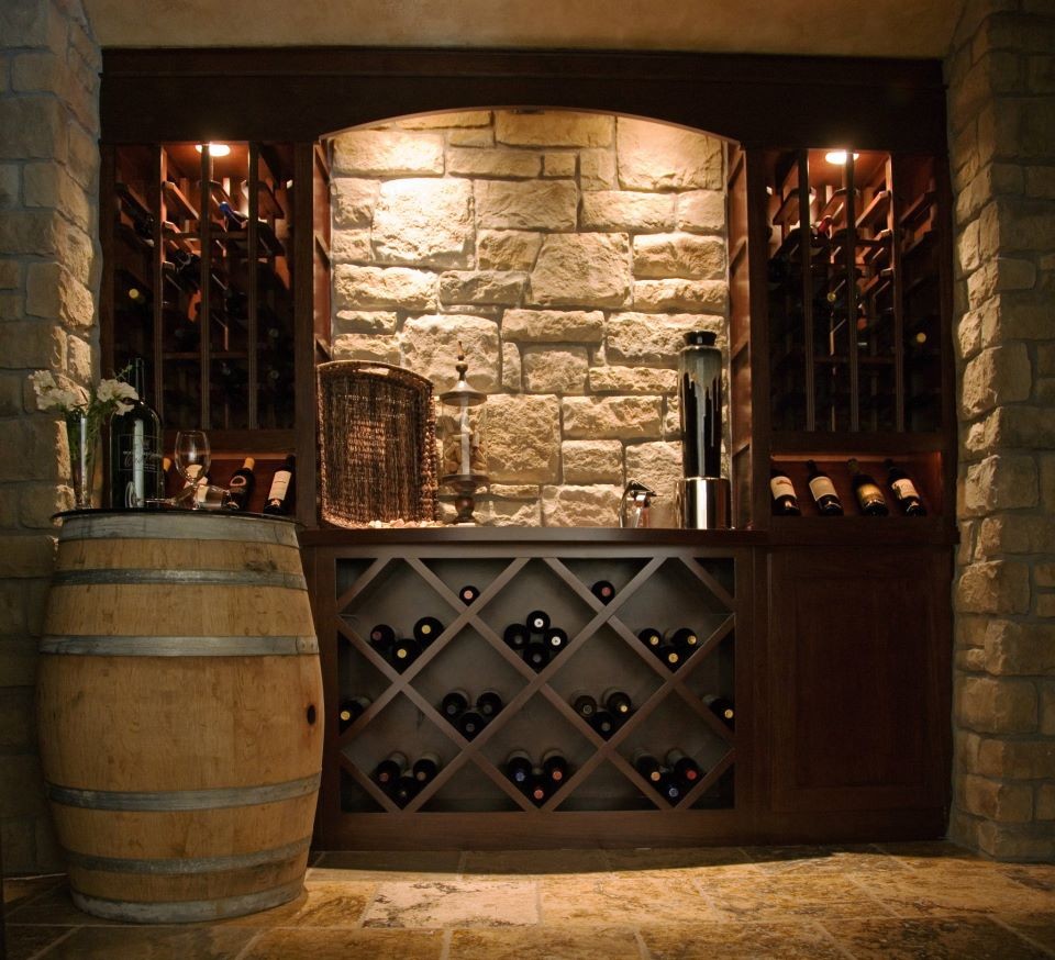 Example of a tuscan wine cellar design in Seattle