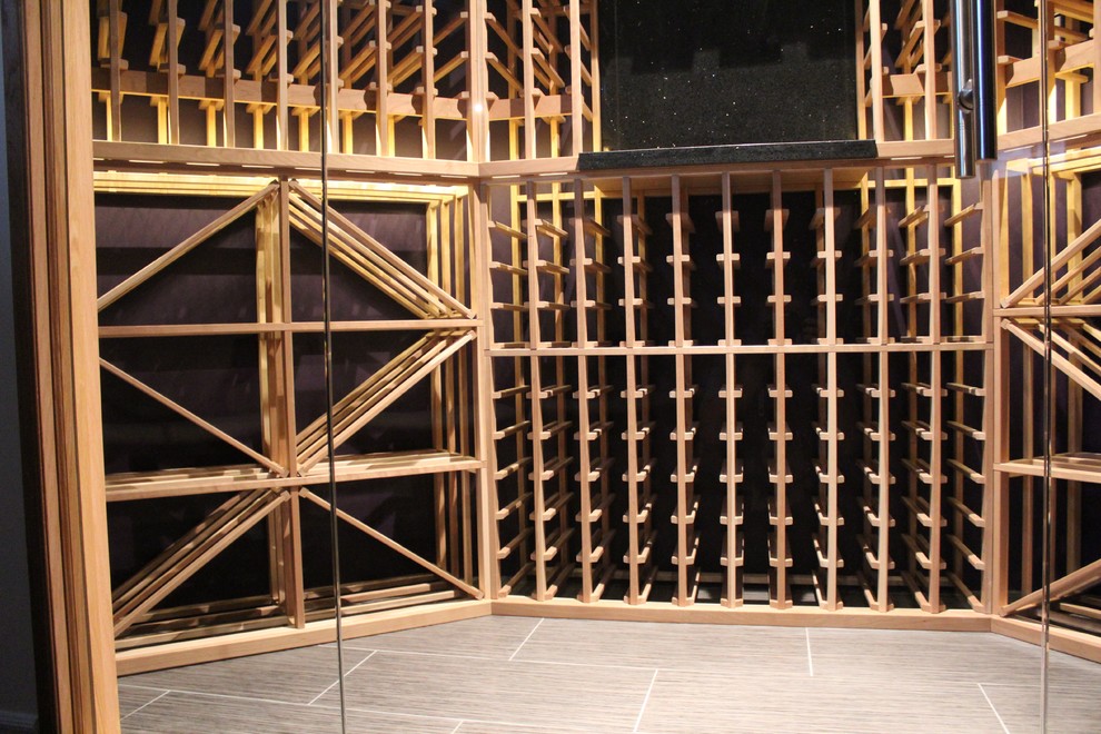 Inspiration for a mid-sized contemporary ceramic tile and beige floor wine cellar remodel in Toronto with storage racks