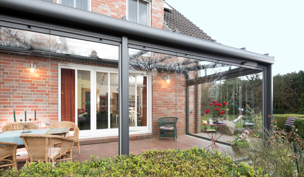 Example of a trendy sunroom design in Hamburg