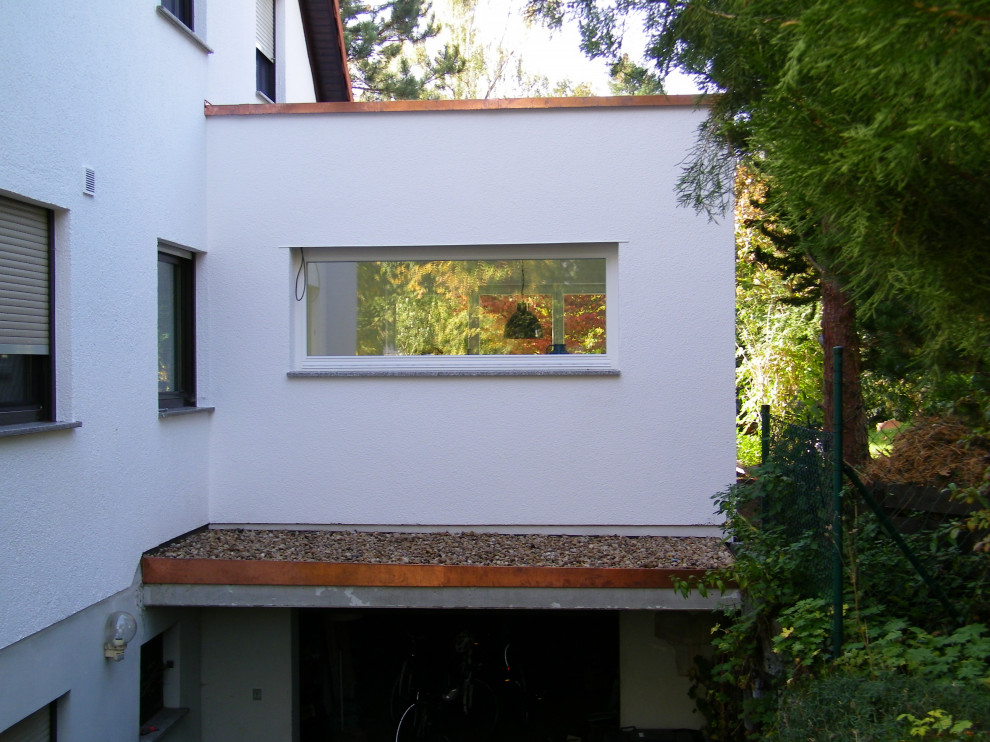 Foto di una piccola veranda design con pavimento in legno massello medio