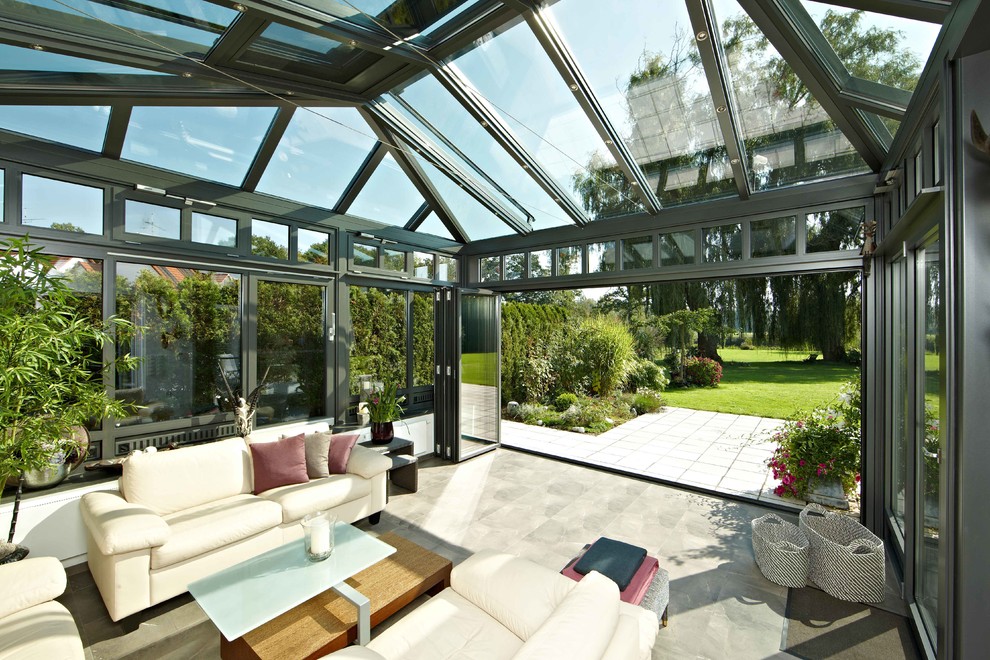 Inspiration for a large traditional conservatory in Other with a glass ceiling and no fireplace.