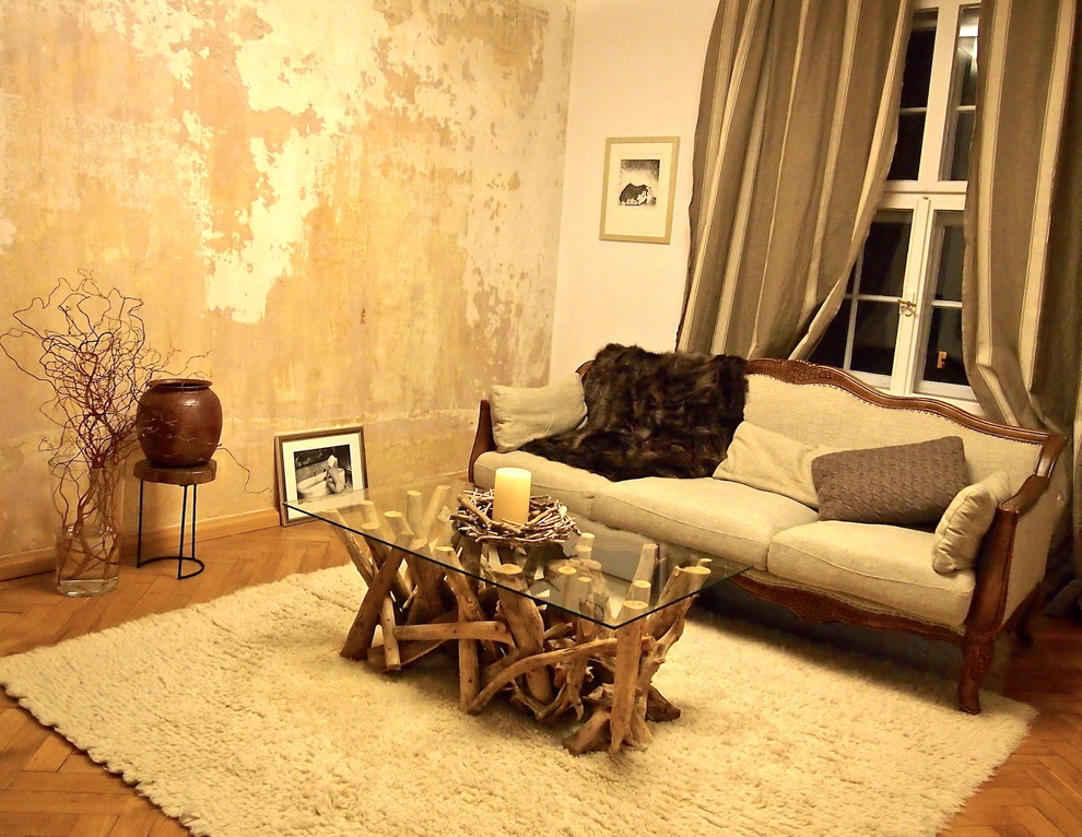 This is an example of a medium sized shabby-chic style enclosed living room in Munich with medium hardwood flooring, no fireplace, brown floors and brown walls.