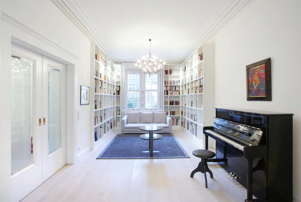 Living room library - large contemporary enclosed light wood floor living room library idea in Dusseldorf with white walls, no fireplace and no tv
