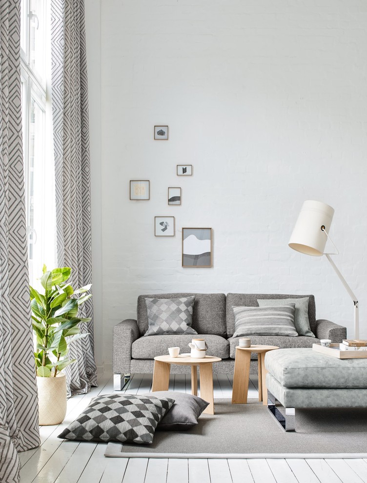 Inspiration for a small scandinavian enclosed painted wood floor and white floor family room remodel in Other with white walls, no fireplace and no tv