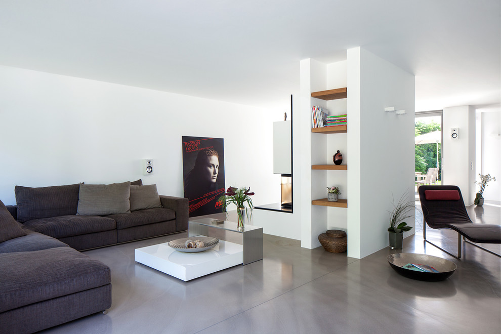 Inspiration for a large contemporary open plan living room in Essen with white walls.