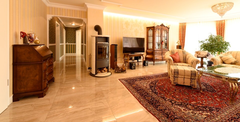 Example of a large island style enclosed ceramic tile and beige floor family room design in Stuttgart with yellow walls, a standard fireplace, a metal fireplace and a tv stand