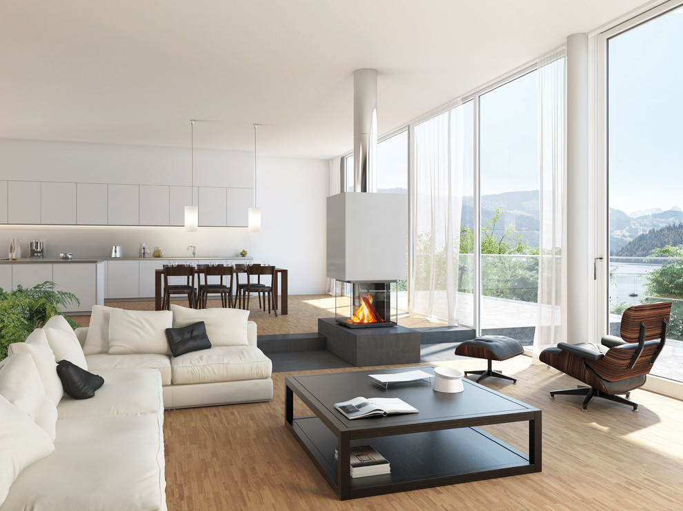 Cette image montre un grand salon design ouvert avec une salle de réception, un mur blanc, un sol en bois brun et une cheminée double-face.