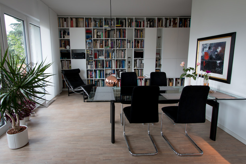 Photo of a large traditional open plan living room in Hamburg with a reading nook and a concealed tv.