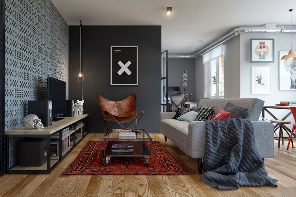 This is an example of a medium sized industrial enclosed games room in Berlin with a reading nook, black walls, light hardwood flooring, no tv, brown floors and no fireplace.