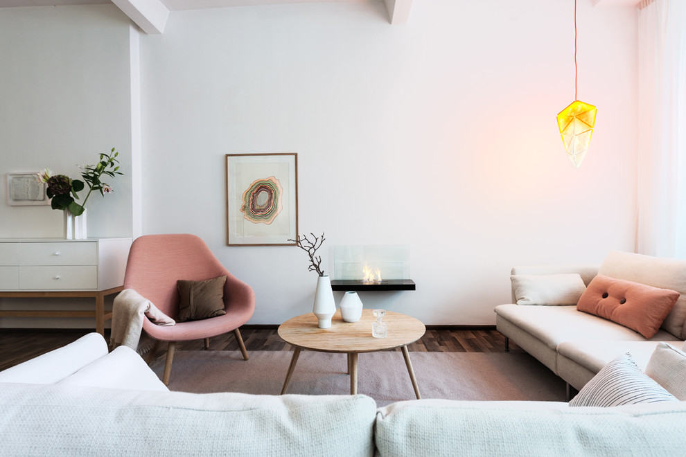 Living room - mid-sized scandinavian formal dark wood floor living room idea in Berlin with white walls and no tv