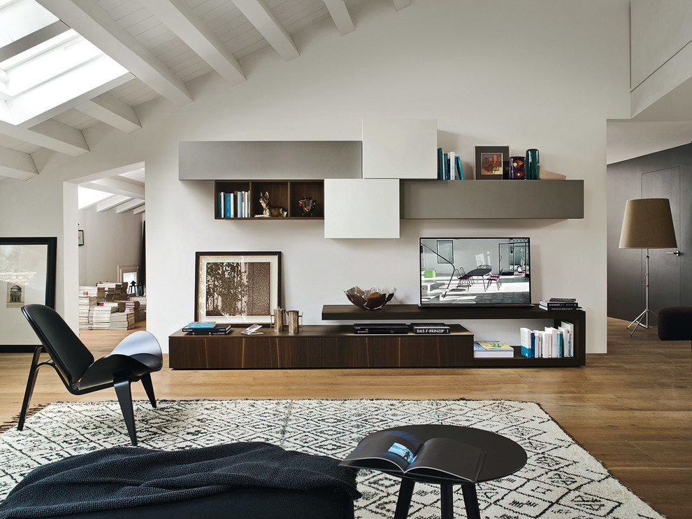 Example of a large trendy formal and loft-style medium tone wood floor and brown floor living room design in Other with white walls, no fireplace, a plaster fireplace and a tv stand