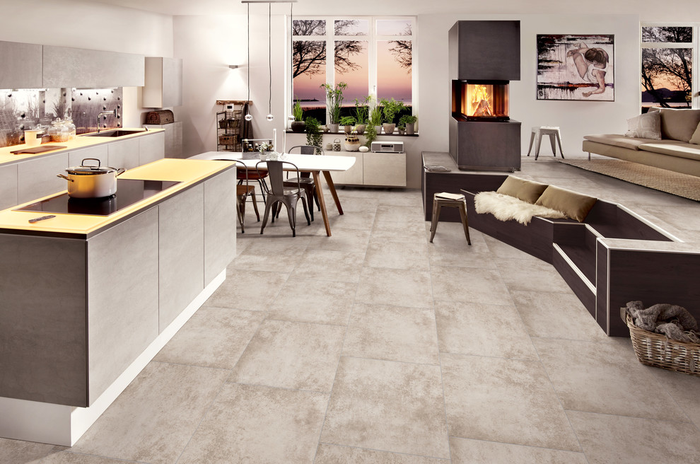 Immagine di un soggiorno design con pavimento in vinile