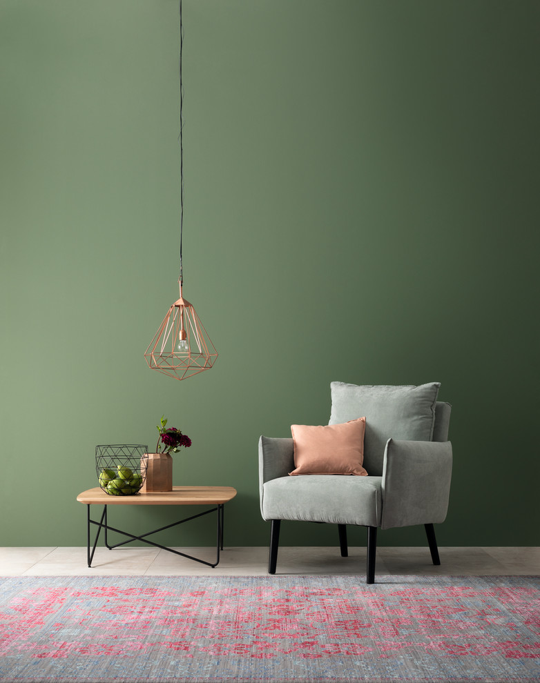Immagine di un soggiorno minimal con pareti verdi