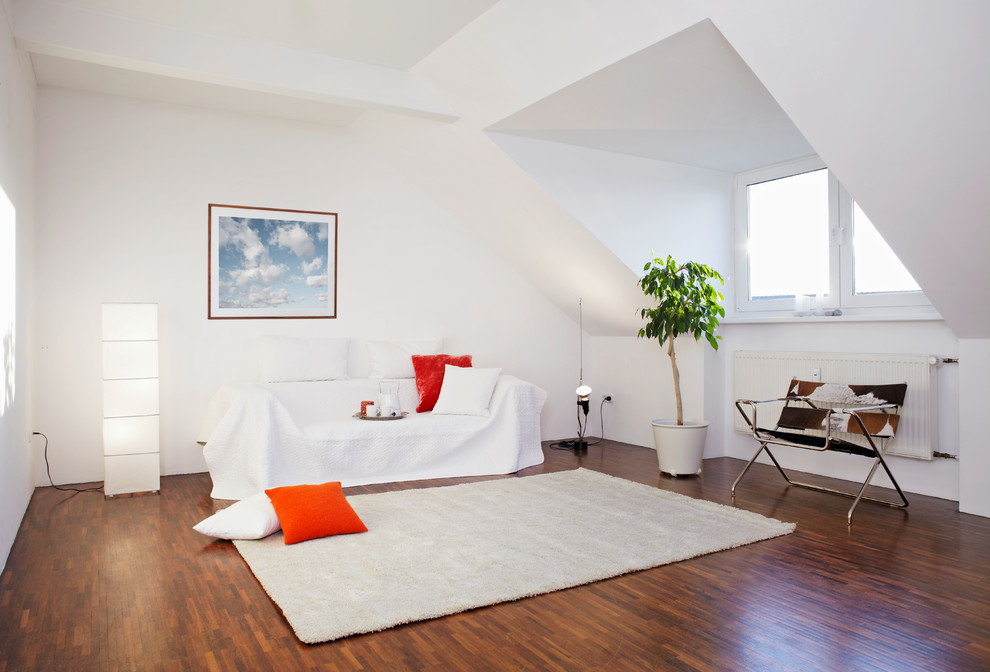 Inspiration for a mid-sized eclectic enclosed dark wood floor living room remodel in Nuremberg with white walls and no fireplace