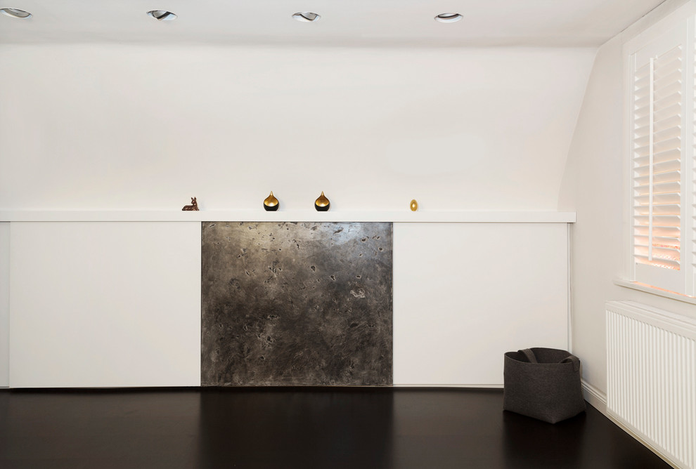 This is an example of a contemporary games room in Hamburg with a concealed tv.
