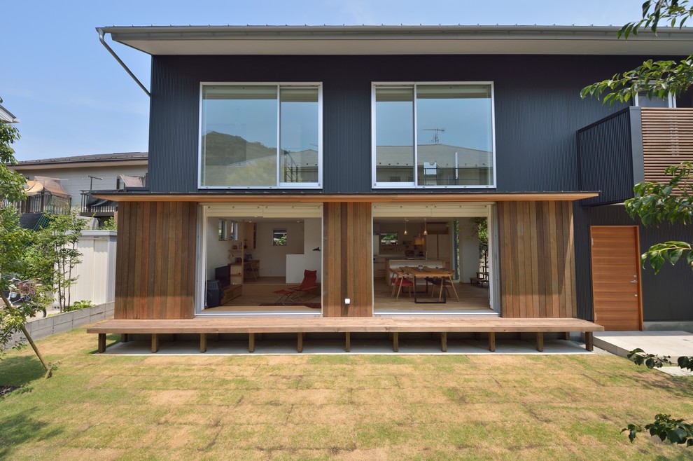 Inspiration pour une terrasse asiatique avec une extension de toiture.