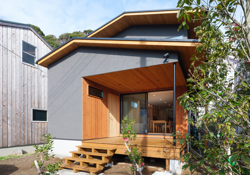 Idées déco pour une terrasse moderne avec une extension de toiture.