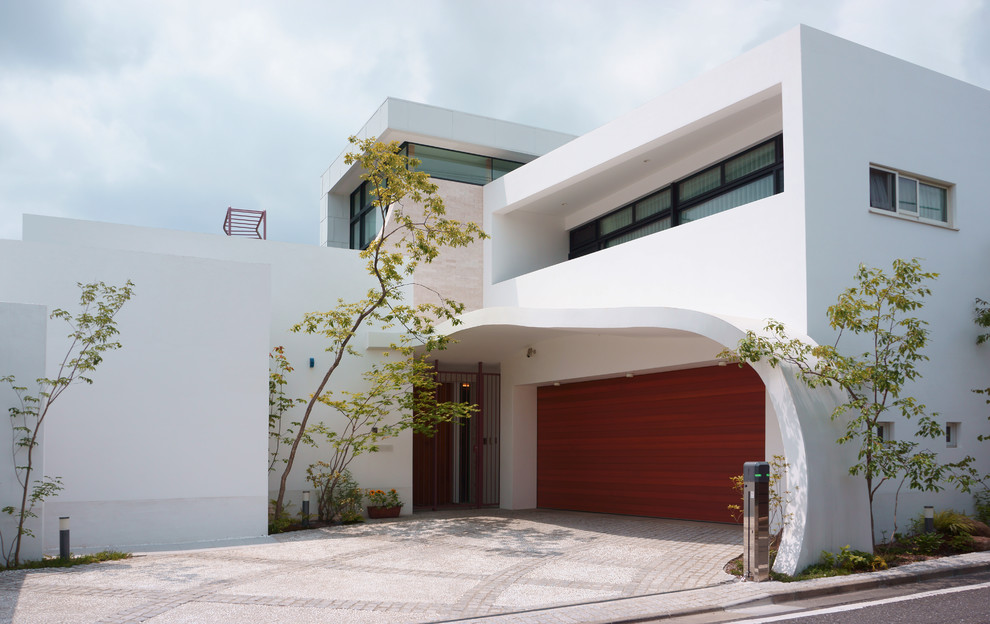 Design ideas for a world-inspired attached garage in Tokyo Suburbs.